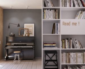 Plenty of shelving for books and a nook for a piano are a bold indication that the apartment  is a home and not just a showcase for design elements.