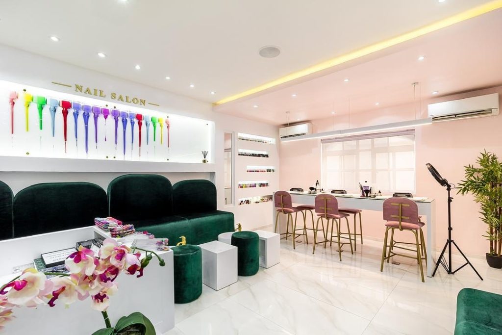 Nailicure nail salon by Ocubed Designs features a high contrast interior colour scheme