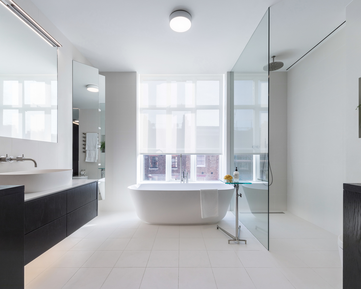 A pristine bathroom design helps revitalise this 40 year old apartment in London.