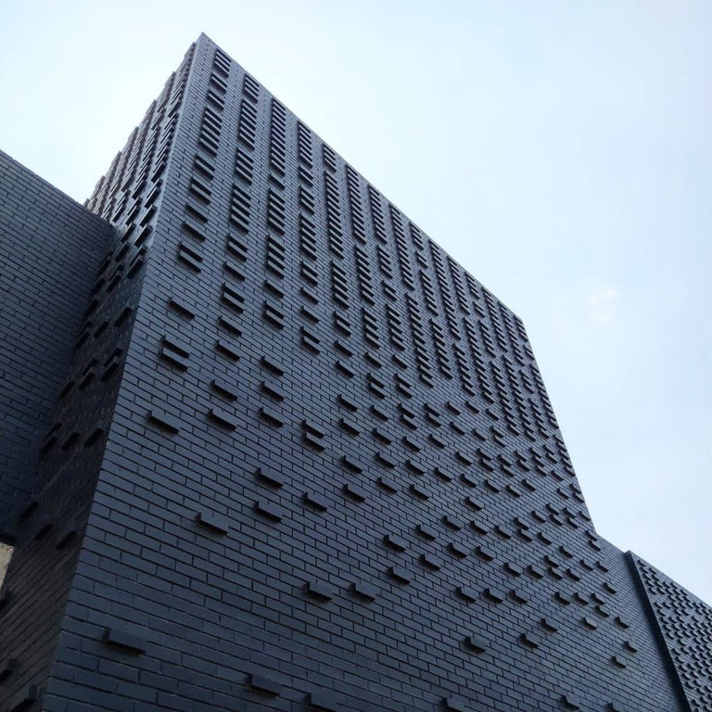 3 dimensional black brick facade detail of 31 commerce