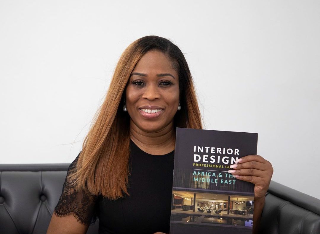 titi ogufere holding new book- Interior Design Professional Guide for Africa and the Middle East