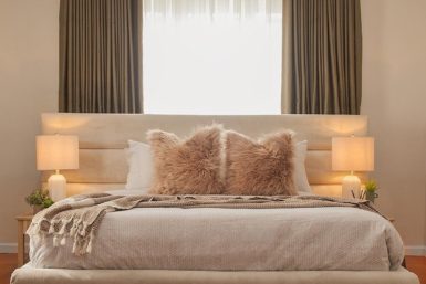 Front view of the bed and bed end in the teenage girl's bedroom decor.