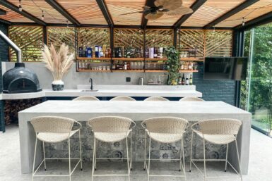 The "after" of the outdoor entertainment area renovation with a view of the new island