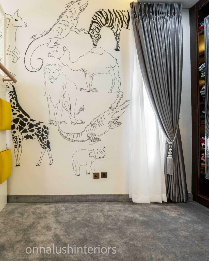 Animal wall mural in boy's bedroom by Onnalush Interiors
