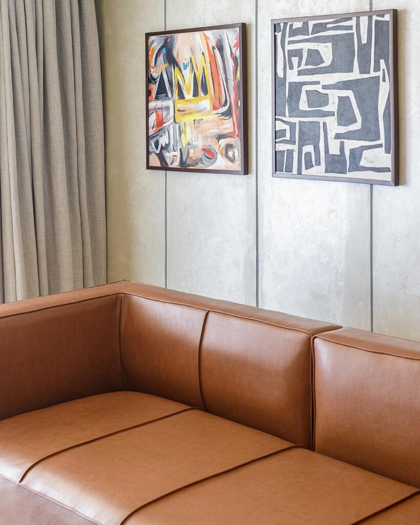 Tuxedo Sofa in Nordic Interior Design of Airbnb Apartment by Interior Culture by Obiageli