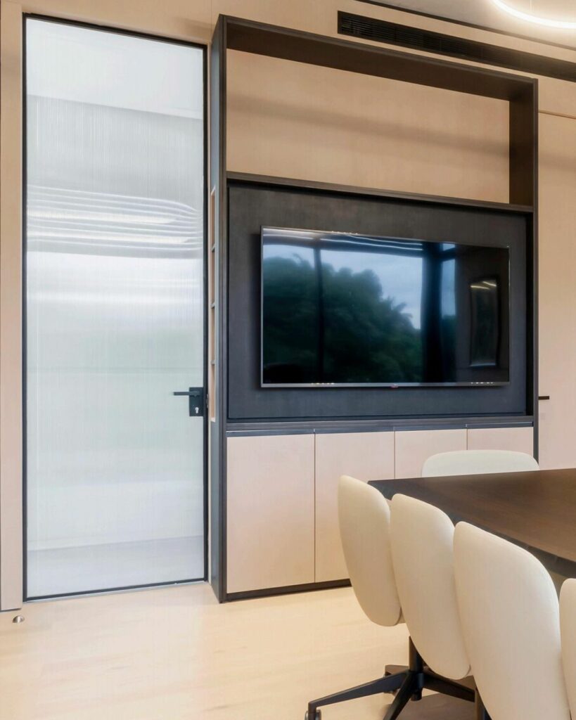 Glass flush-fitted door in conference room