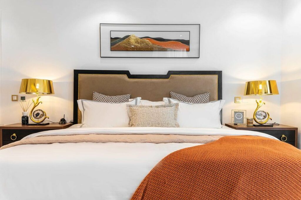 Tangerine-Infused Contemporary Bedroom Design by Maison Consulting