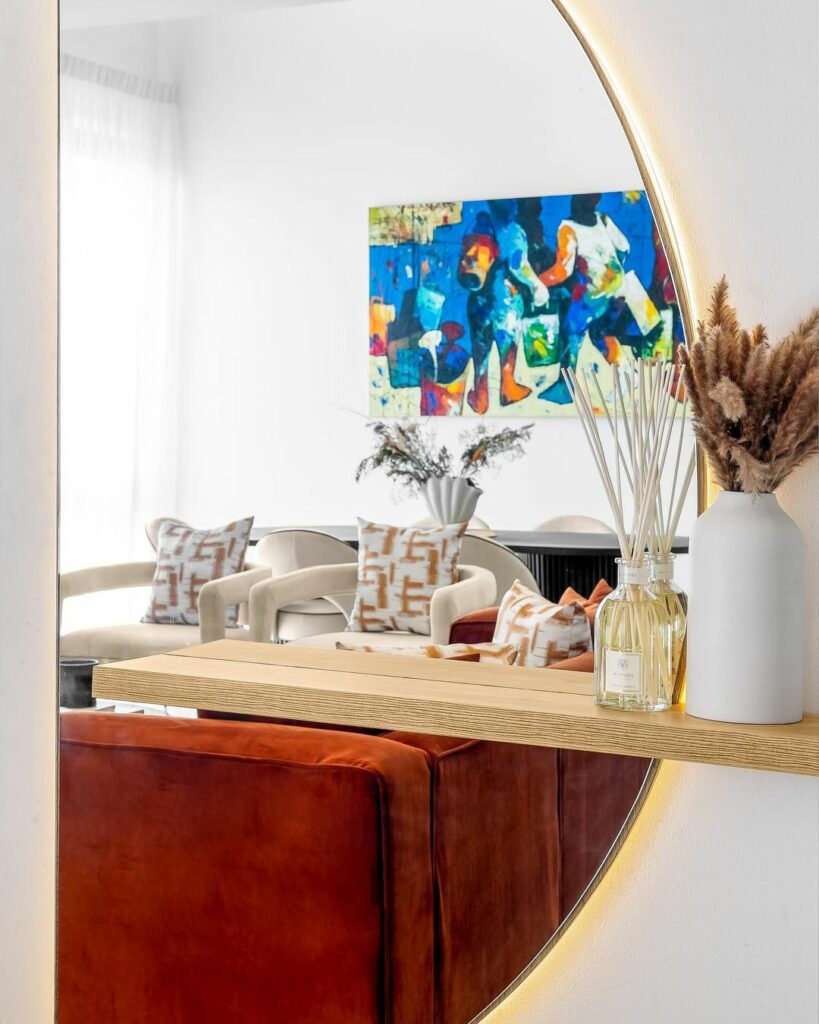 Semi-circular mirror in Contemporary Living Room Design by ICORA Home