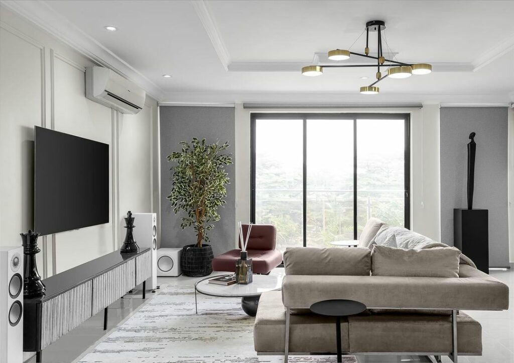 Entertainment area in Jayvane Interior's Trendy Neutral Living Room Design