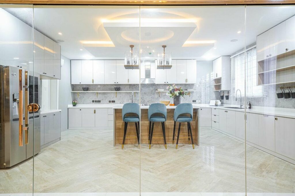 Full View of Modern White Kitchen by Ouevre Designs