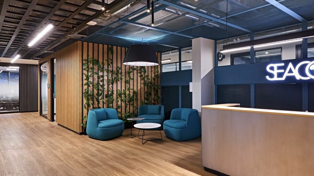 Reception in retro-industrial Workplace Design by Design Partnership for SEACOM