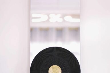 Stadium-shaped Mirror By Mwinda on wall