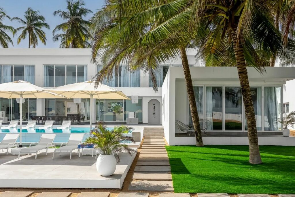 Exterior view of Salt beach Lagos, a modern minimalist beach house by Studio Kumolu