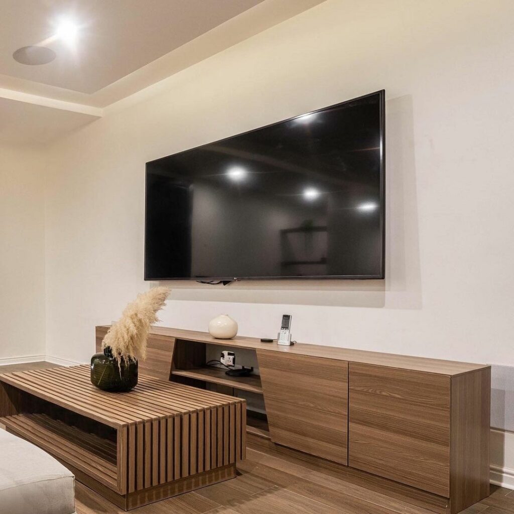 TV wall in Functional Modern Man Cave By HOA Interiors