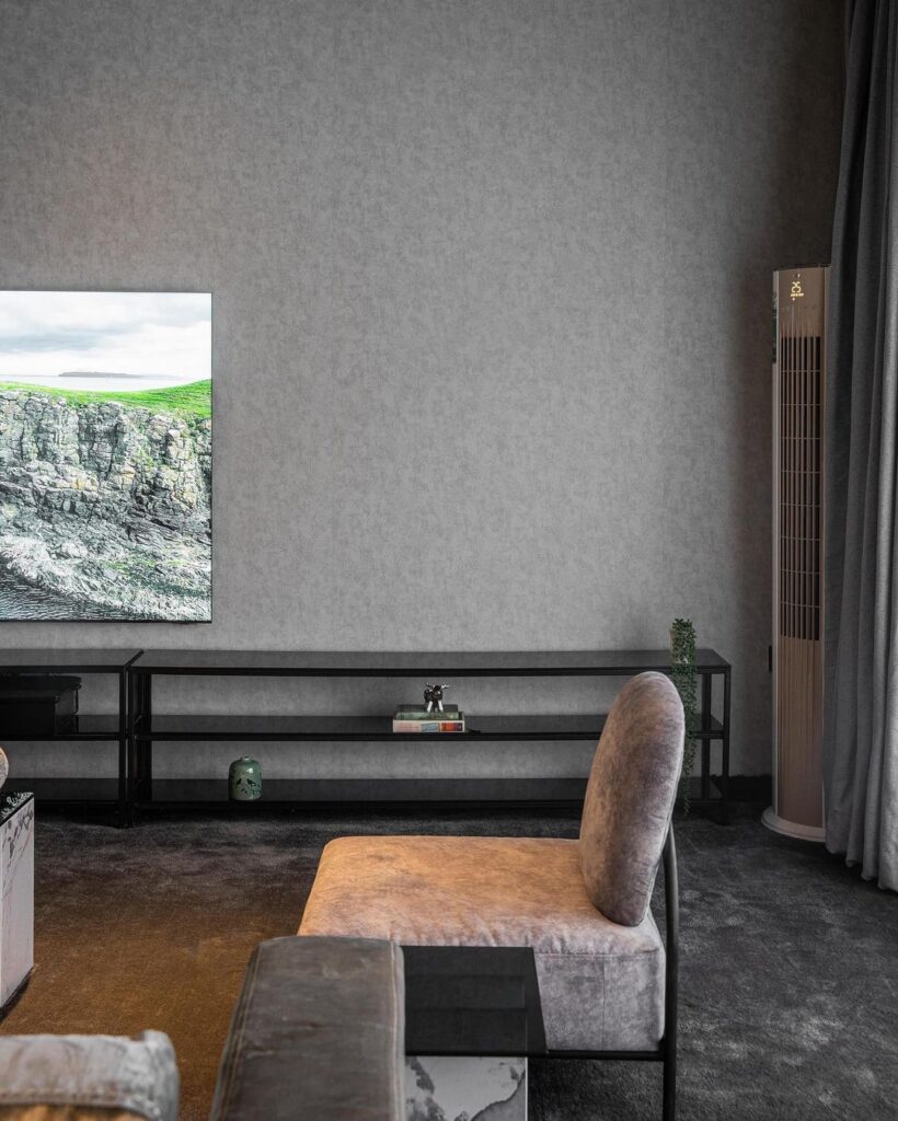 TV Wall in Monotone Living Room by Interior By Stratford