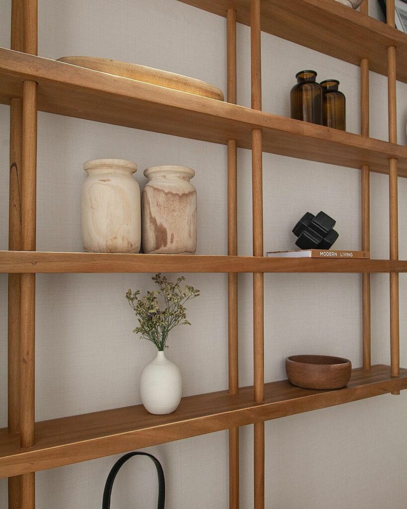 Drop down shelf in tranquil Living Room Design By RM Design Studio