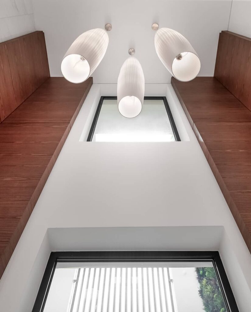 Unique drop down lights in minimalist home in Lagos By Idlewoods Limited