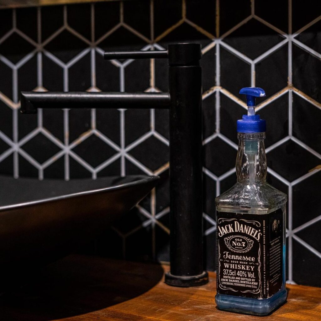 Jack daniels hand wash in artsy rustic-industrial private fashion lounge.