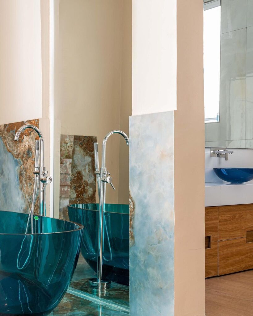 Bath tub in Ocean Blue Bathroom By Serdamol Interiors