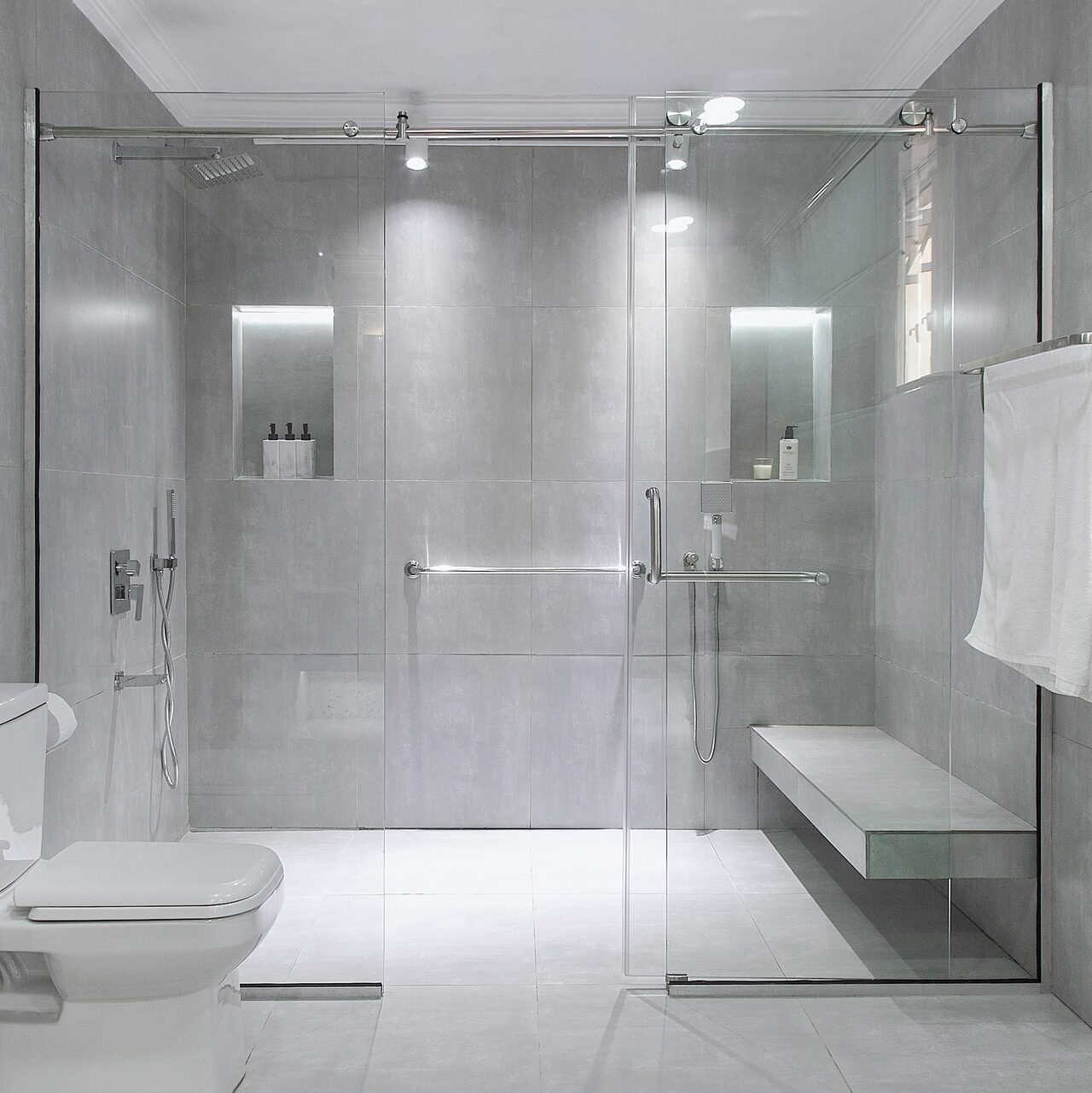 Shower Area in this modern bathroom renovation by 2107 Atelier.
