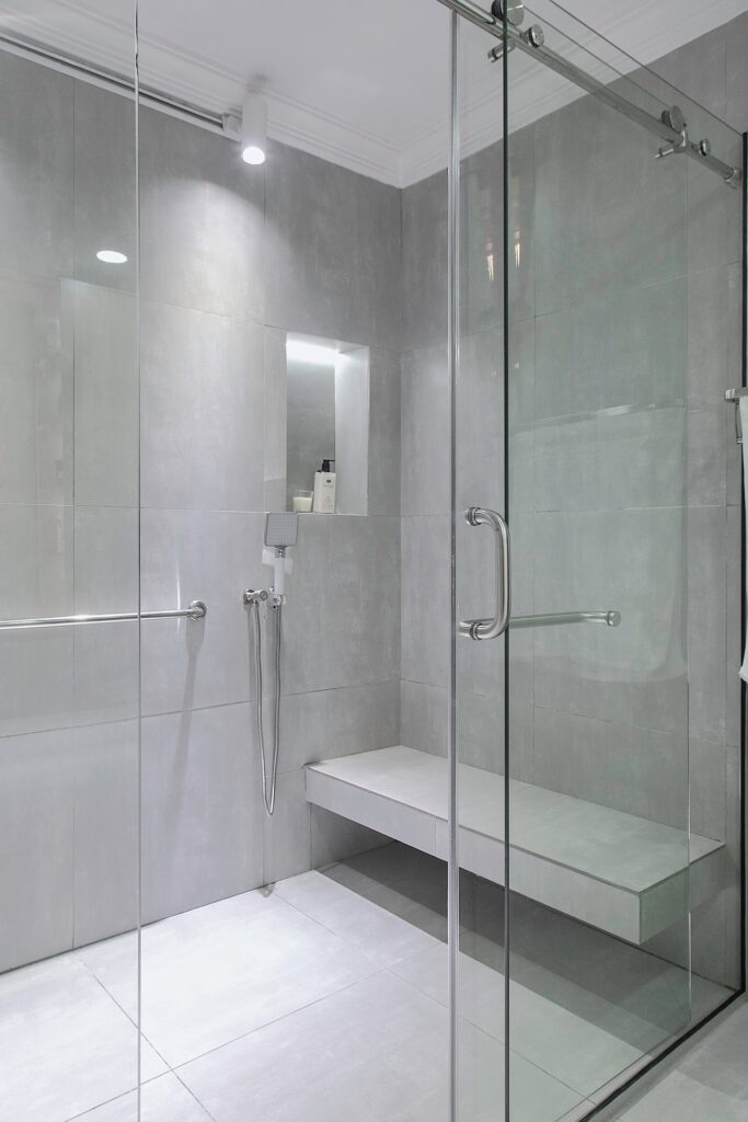 Shower Area in this modern bathroom renovation by 2107 Atelier.