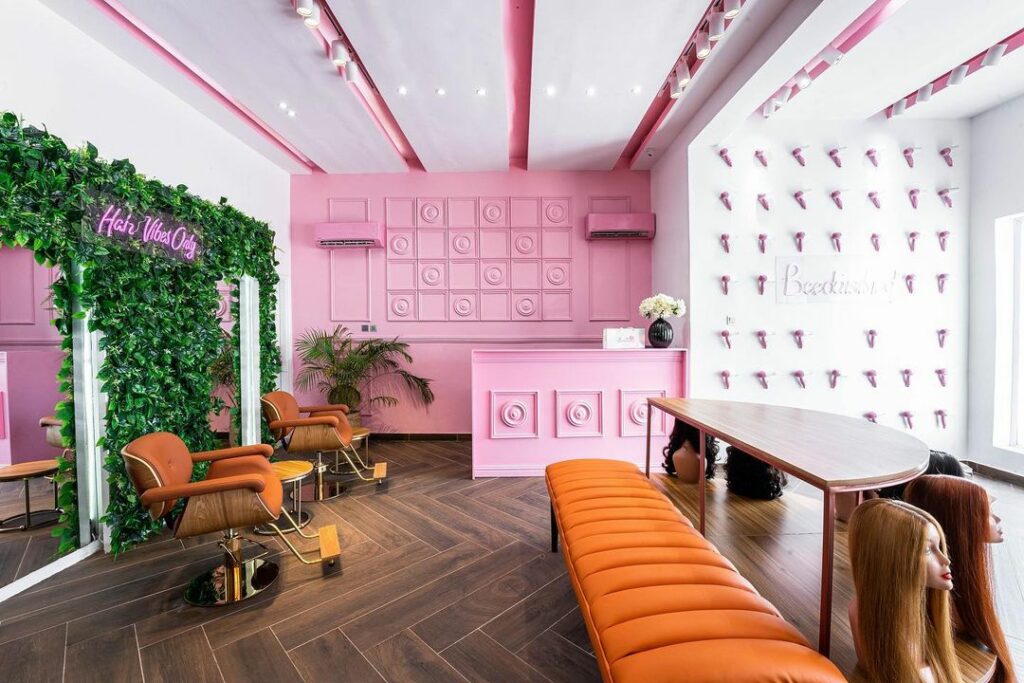 Wig display and styling section in Pink-Themed Beauty Store Fit-Out By TMSorayaa