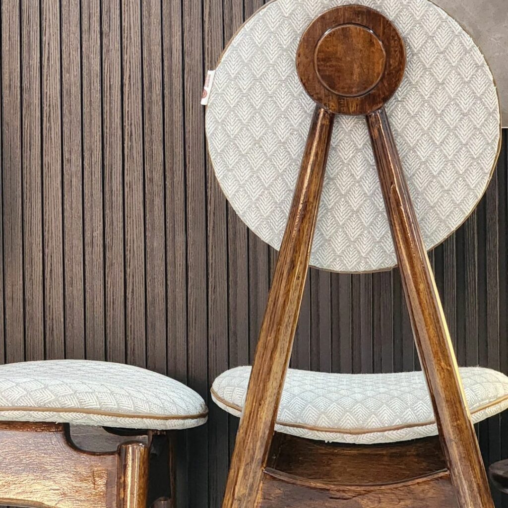 Back view of danish-style circle dining chairs by sobest furniture, a furniture production company in Benin City.