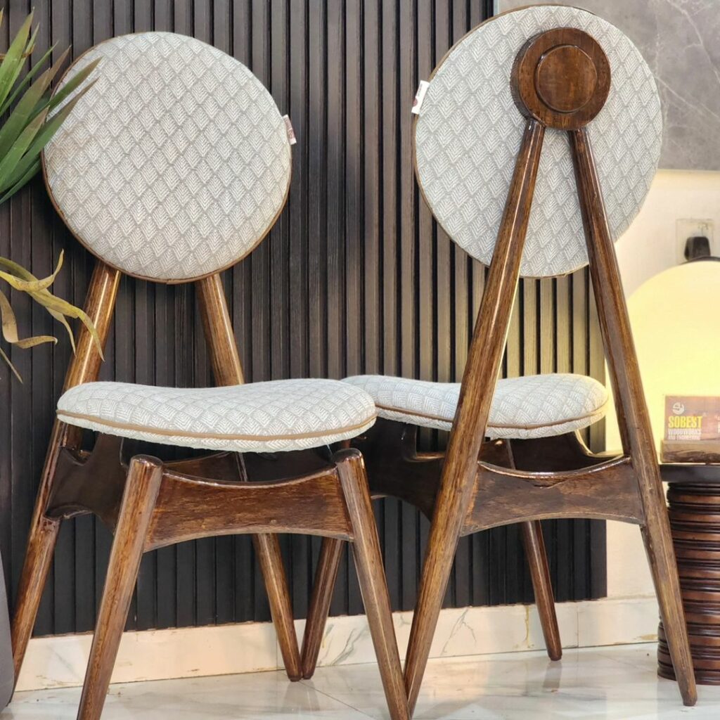 Two danish-style circle dining chairs by sobest furniture in Benin City.