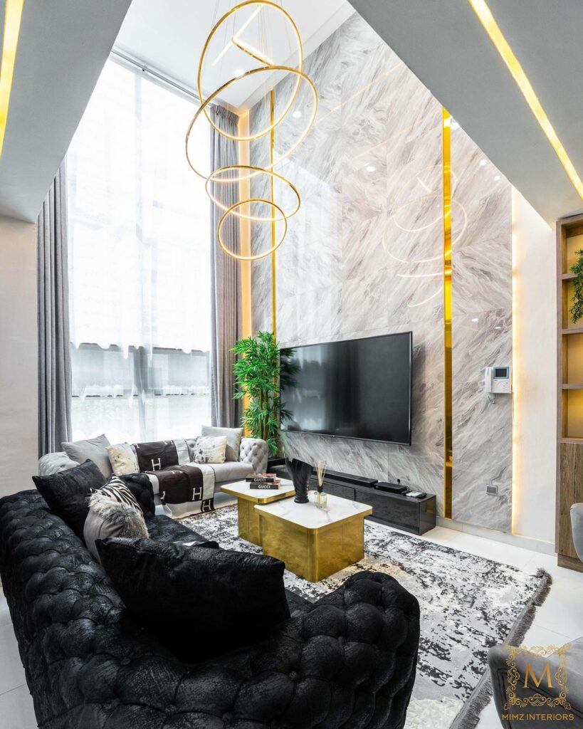 Monochromatic Living Room with gold accents by Mimz Interiors