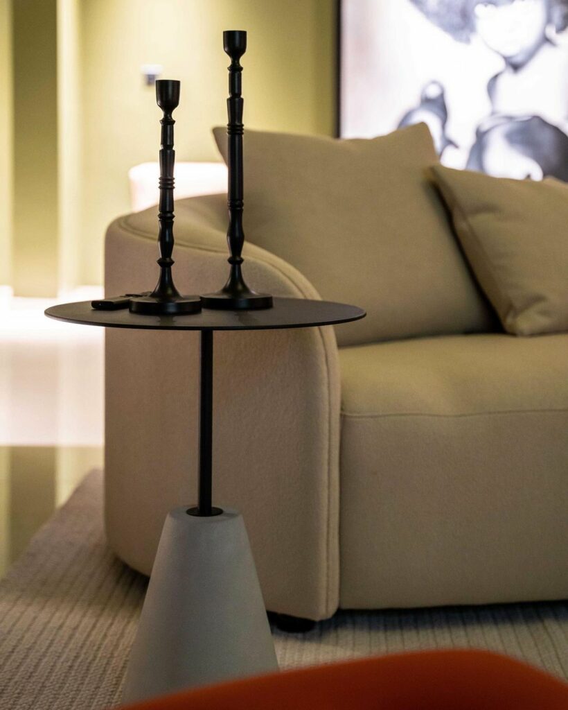 Chalice side table with decor on it