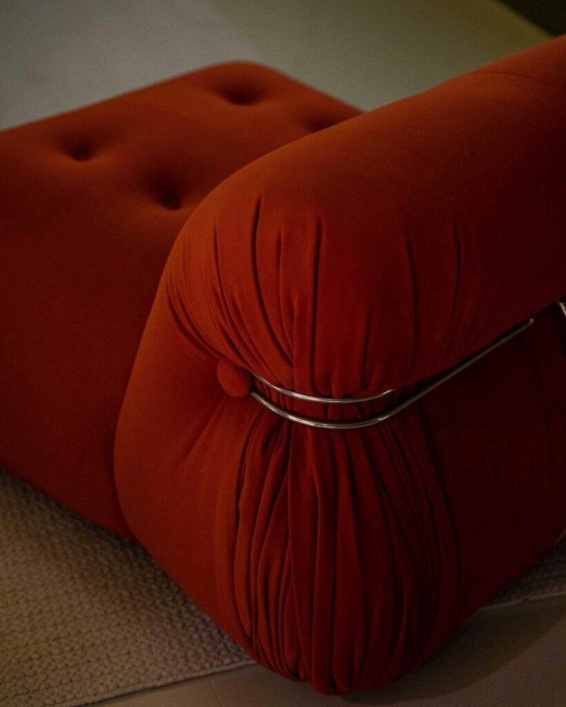 Burnt orange ottoman style single sofa