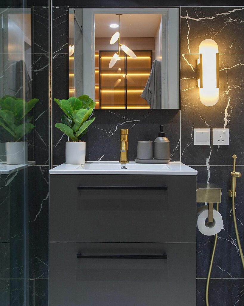 sink area in dark-themed master bathroom In Project Blue by OliveHaus Interiors