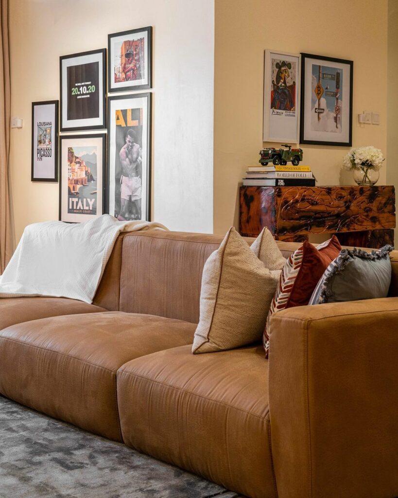 Sectional sofa in Rustic Minimalist Living Room Design By BrandBoy Studios