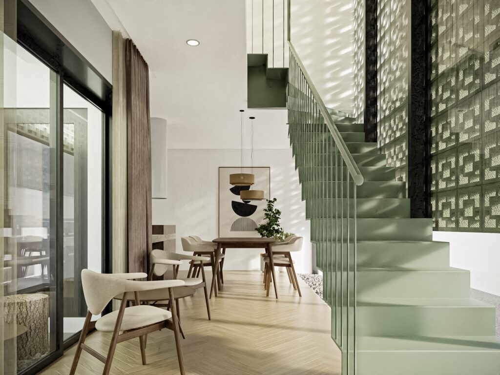 Dining area by green interior stair case.