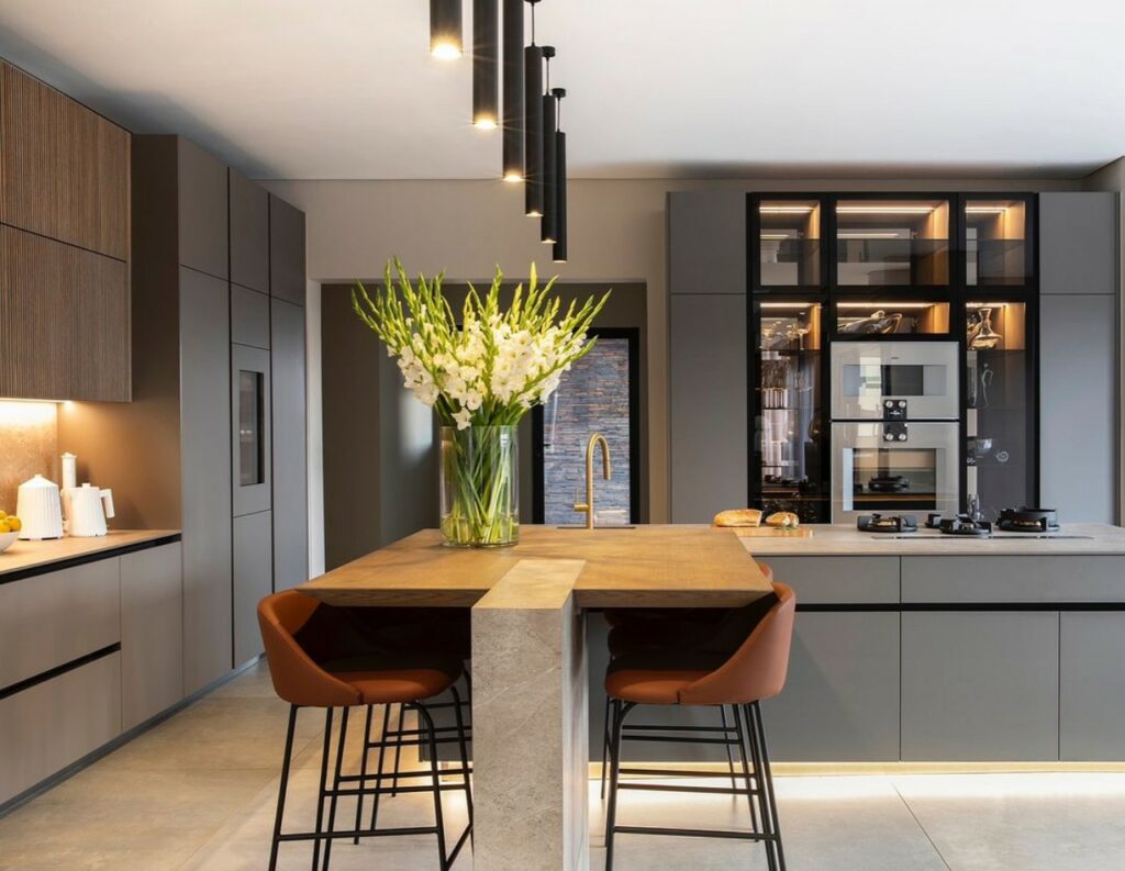 Grey and wood moder open Kitchen in family home in Johannesburg by Donald Nxumalo.