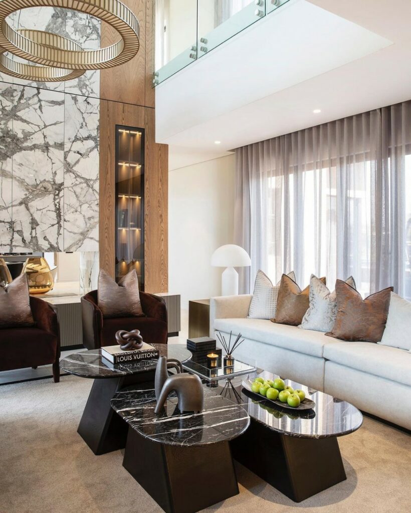 Family living area in modern family home in Johannesburg by Donald Nxumalo showing the layered black marble coffee table.