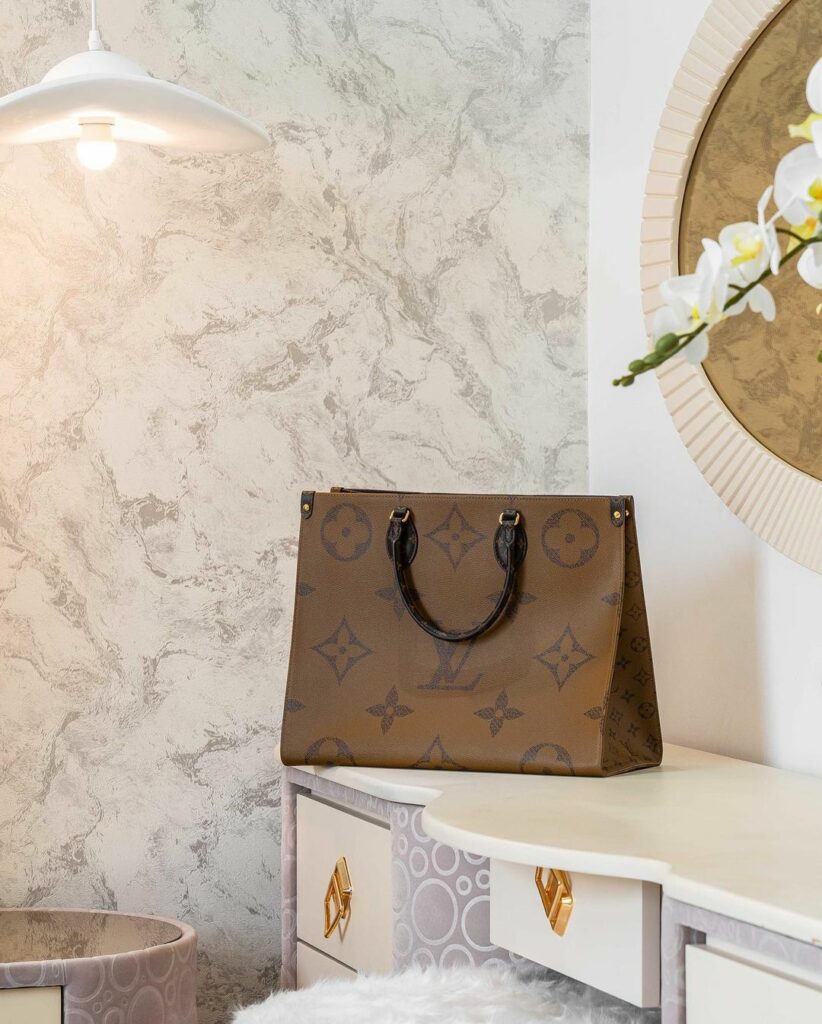 Louis Vuitton bag on a stylish dresser