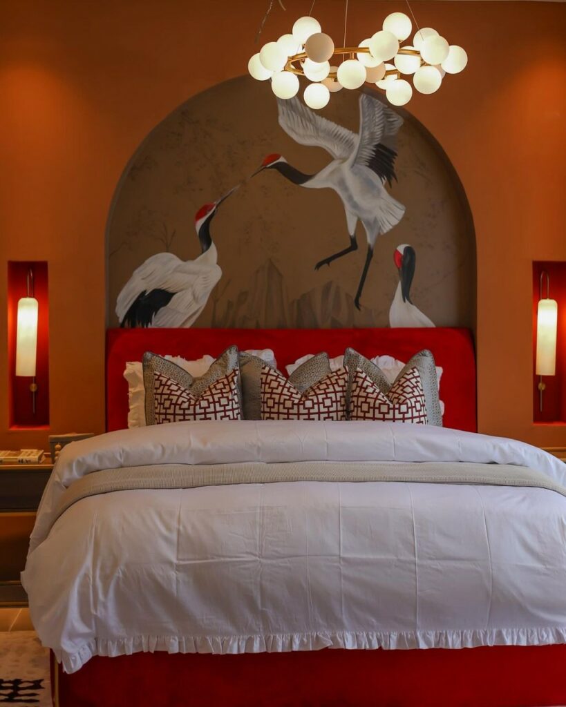 Warm Master bedroom with a statement mural.