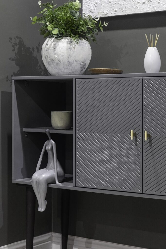 Close up shot of grey console in living room design by La Maison Douillet.