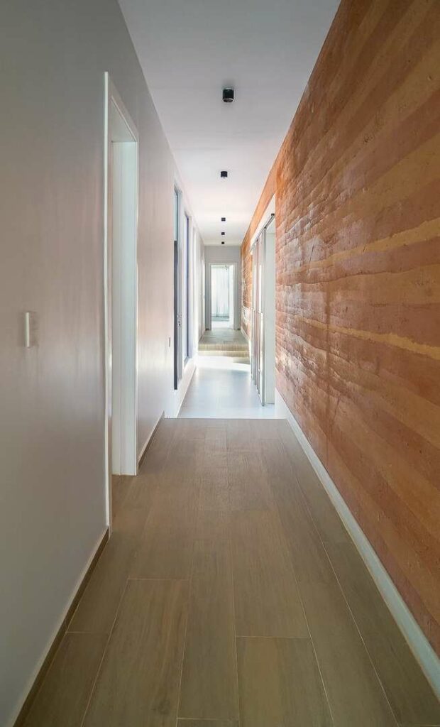 Corridor in the Ubikwiti House with rammed earth construction.