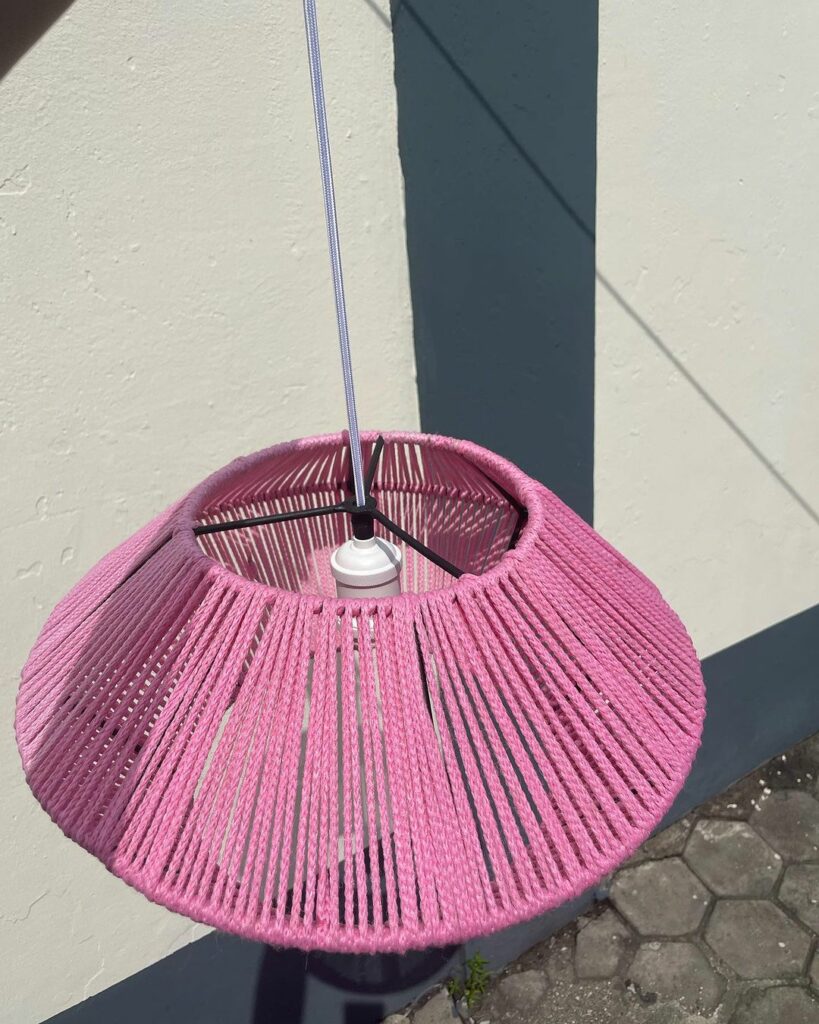 Pink Yarn Afrocentric pendant lights.
