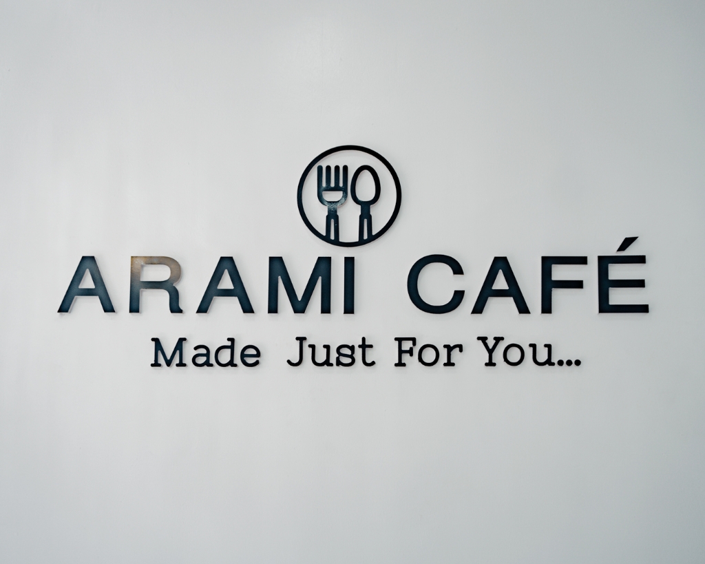 Arami Cafe brand sign.