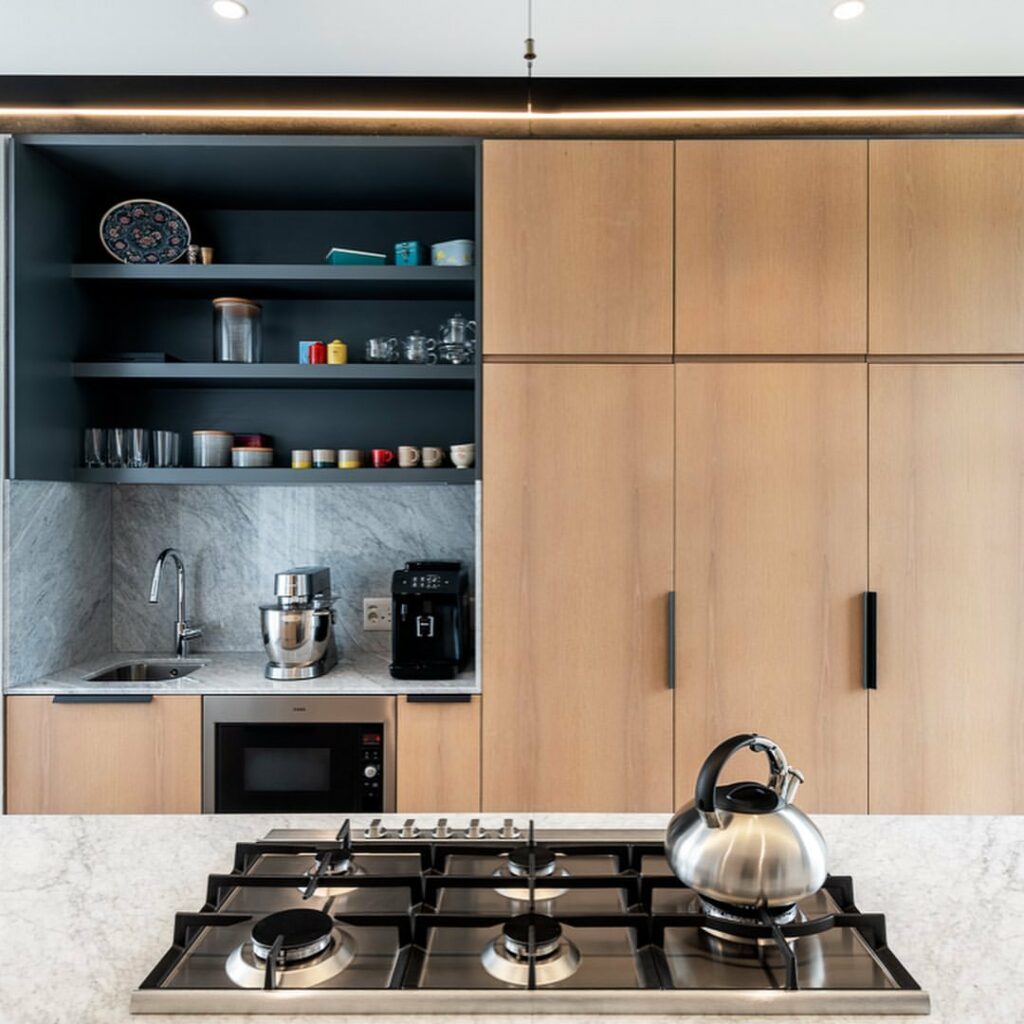 Cabinetry in modern kitchen by 255 Architects.