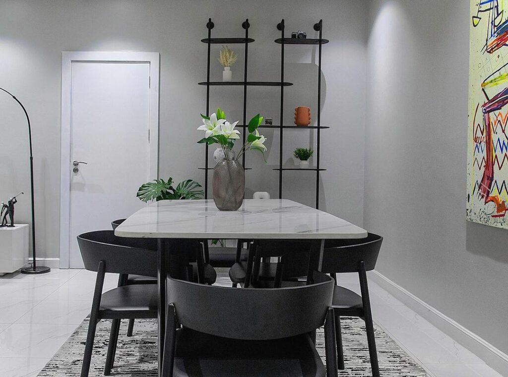 Dining area in gray living room by Mandora Design
