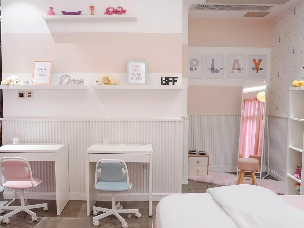 A view of the play area in the girls' bedroom featuring a standing mirror - perfect for playing dress up.