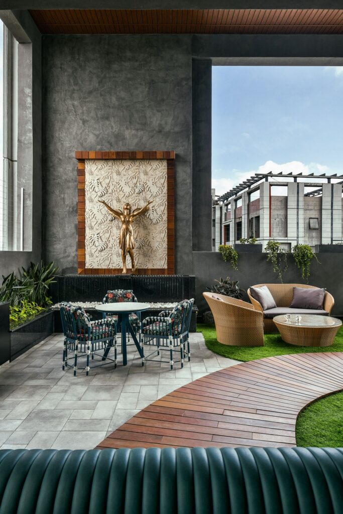 Outdoor area in luxurious home in Kolkata showing the outdoor furniture.