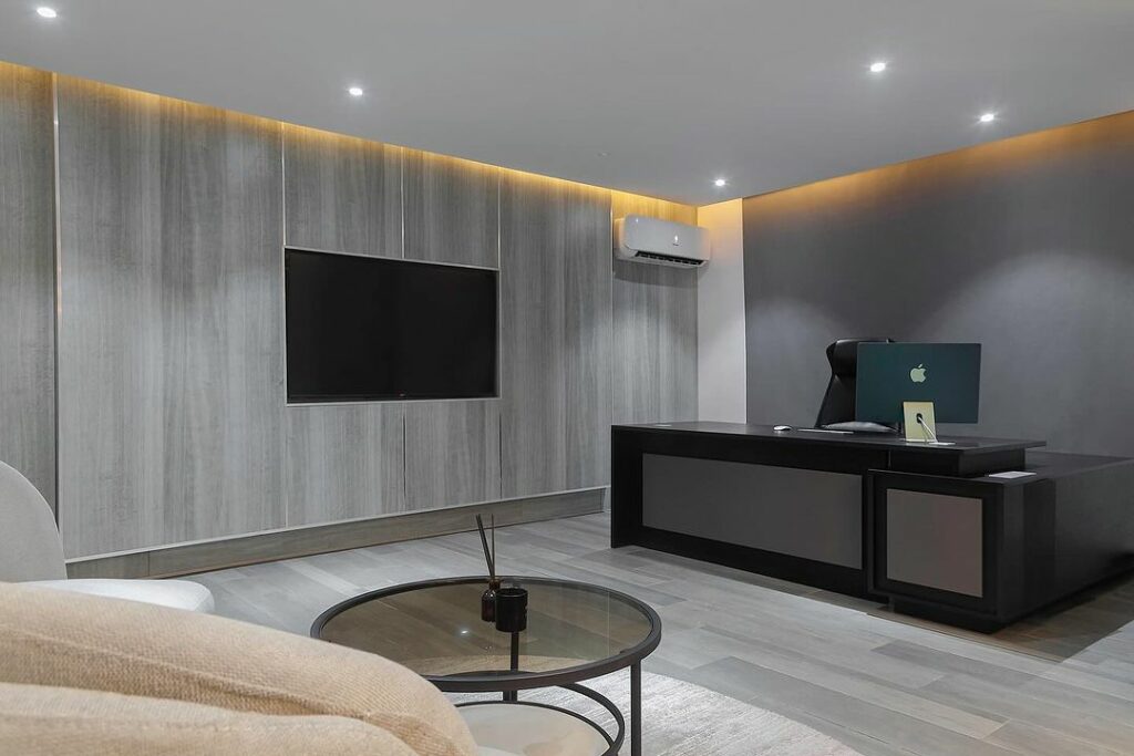 Modern office interior with cladding TV wall.