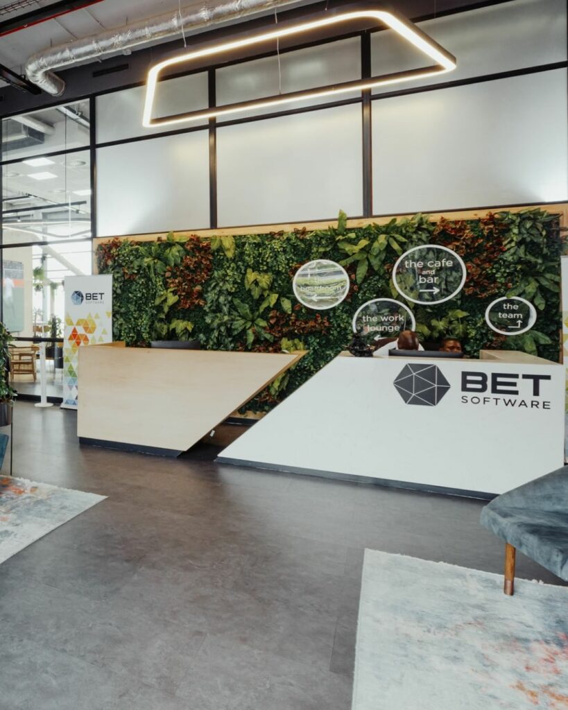 A sleek and modern office interior design for BET software company, featuring a stylish reception desk
