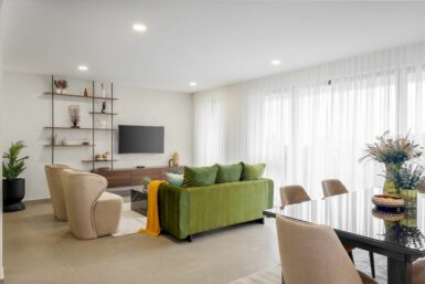 Open living area with plush green sofa.