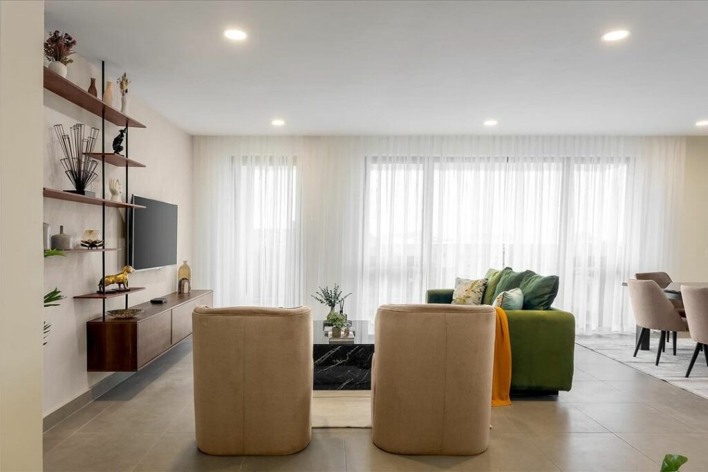 Two single sofas in the sitting area of this modern living room interior.